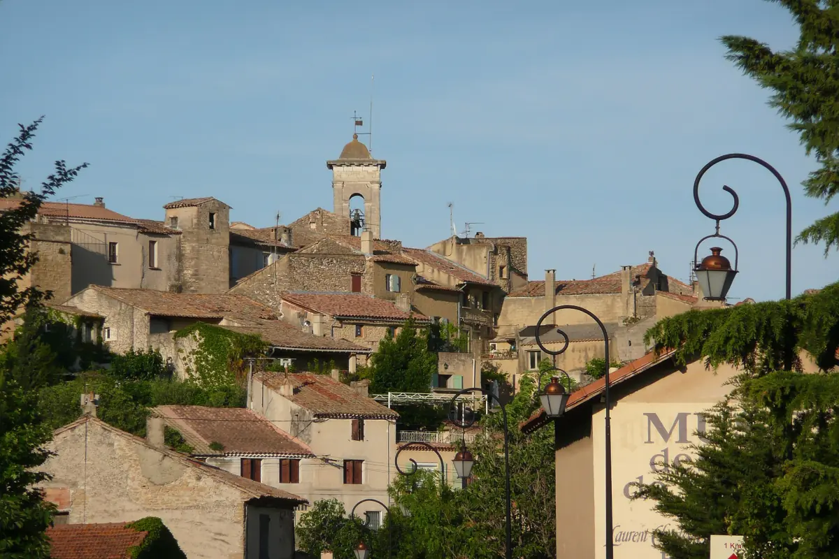 Old village of Châteauneuf-du-Pape with stone houses below a castle ruin