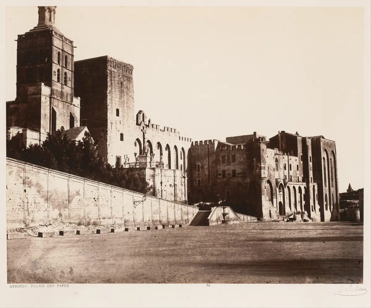 Sepia historic photograph of the Palais des Papes and its fortified walls