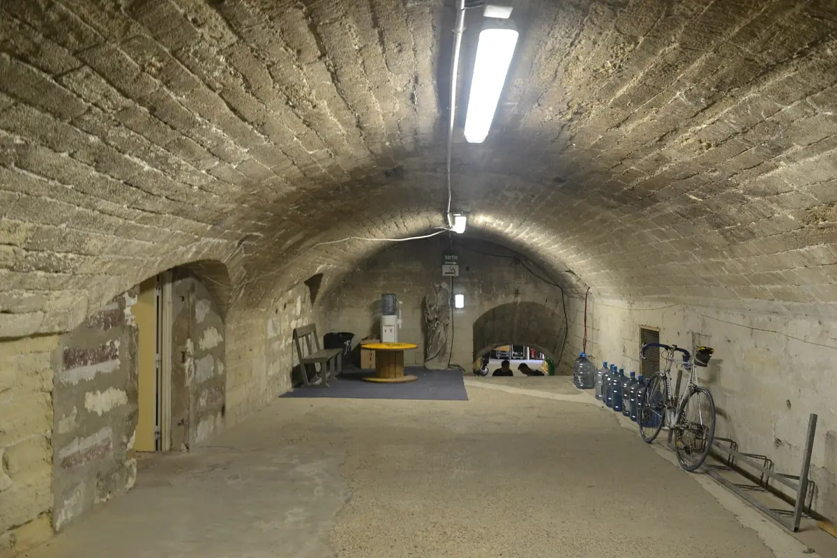 Long vaulted stone hall with rough walls inside the papal palace
