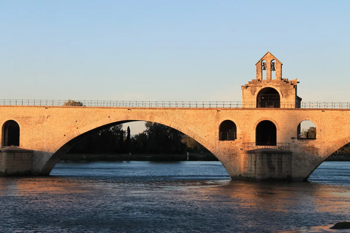Central arch of Pont Saint-Bénézet and its chapel over the Rhône at sunset