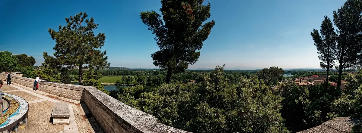 Panorama of the Rhône valley with trees and a stone terrace in Avignon